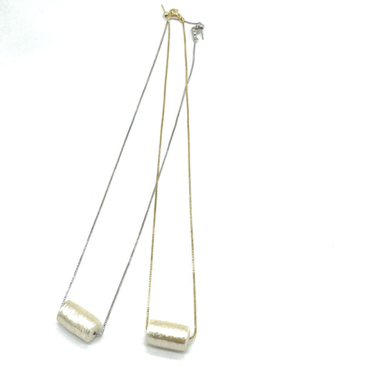 Two necklaces with tubular pearl pendant on a white background