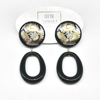 Black and gold floral earrings on a white background with 'Leetie Lavendale' branding.