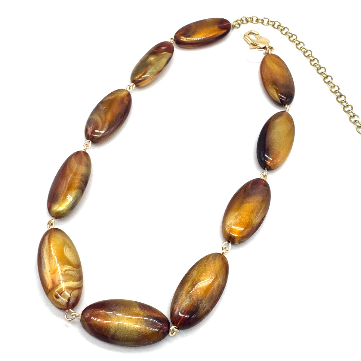 Necklace with brown oval beads on a white background